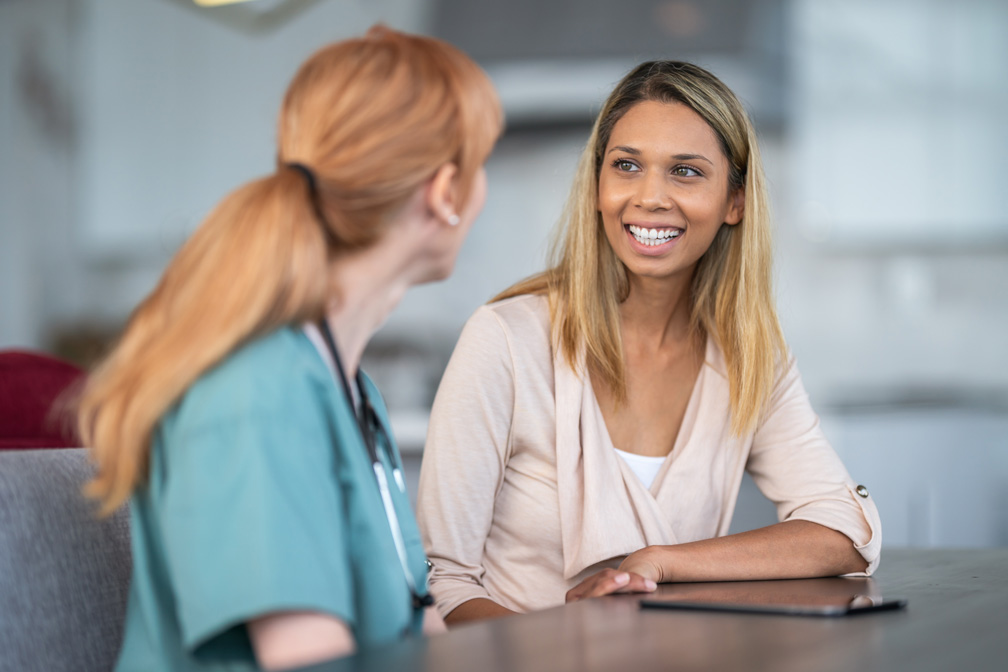 Nurse consulting with female patient